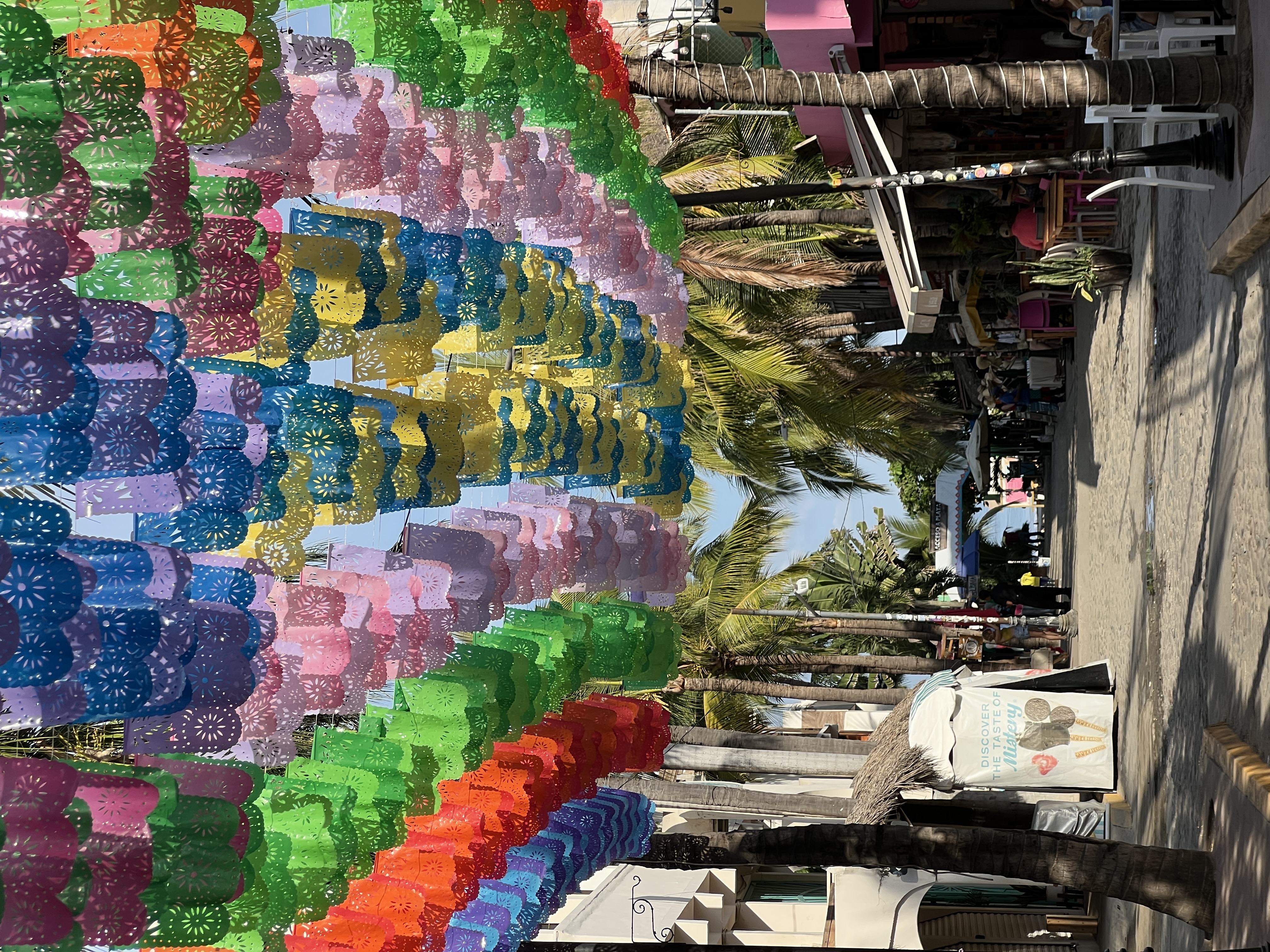 Street lined with colorful papel picado banners