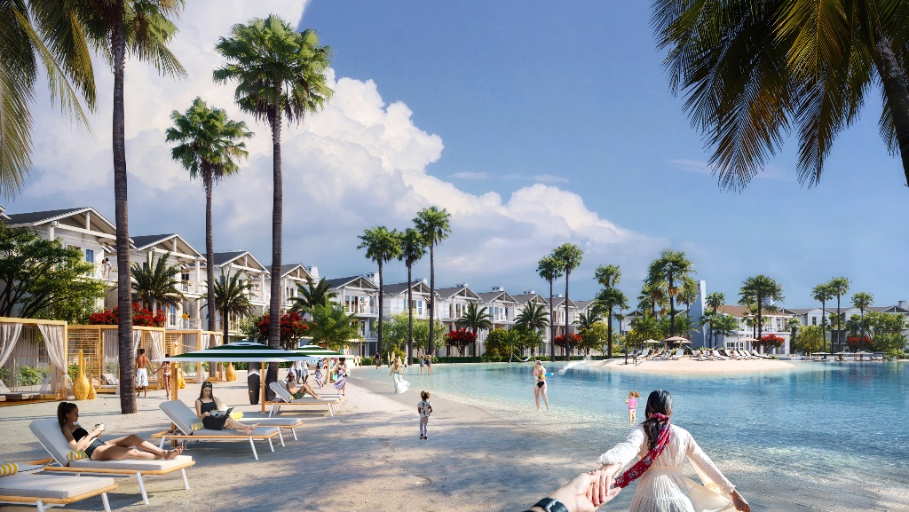 Vacation villas along the lagoon beach with palm trees