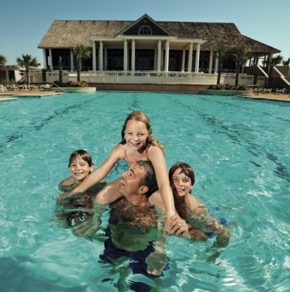 Family enjoying the pool at the vacation villas