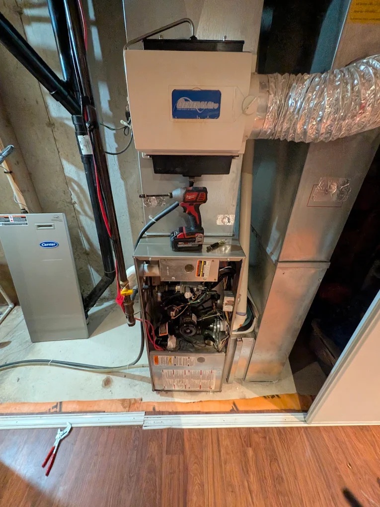 Furnace Installation Calgary in Calgary — Furnace replacement in progress — Carrier unit serviced on-site