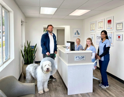Our front lobby — FTLOP staff welcoming a client and their dog at the front desk
