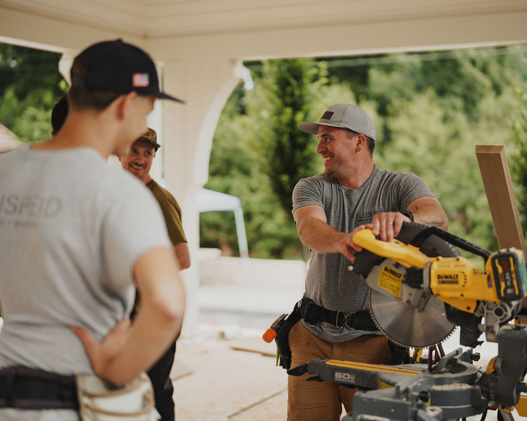 Ellis-Reid crew laughing together at the saw station