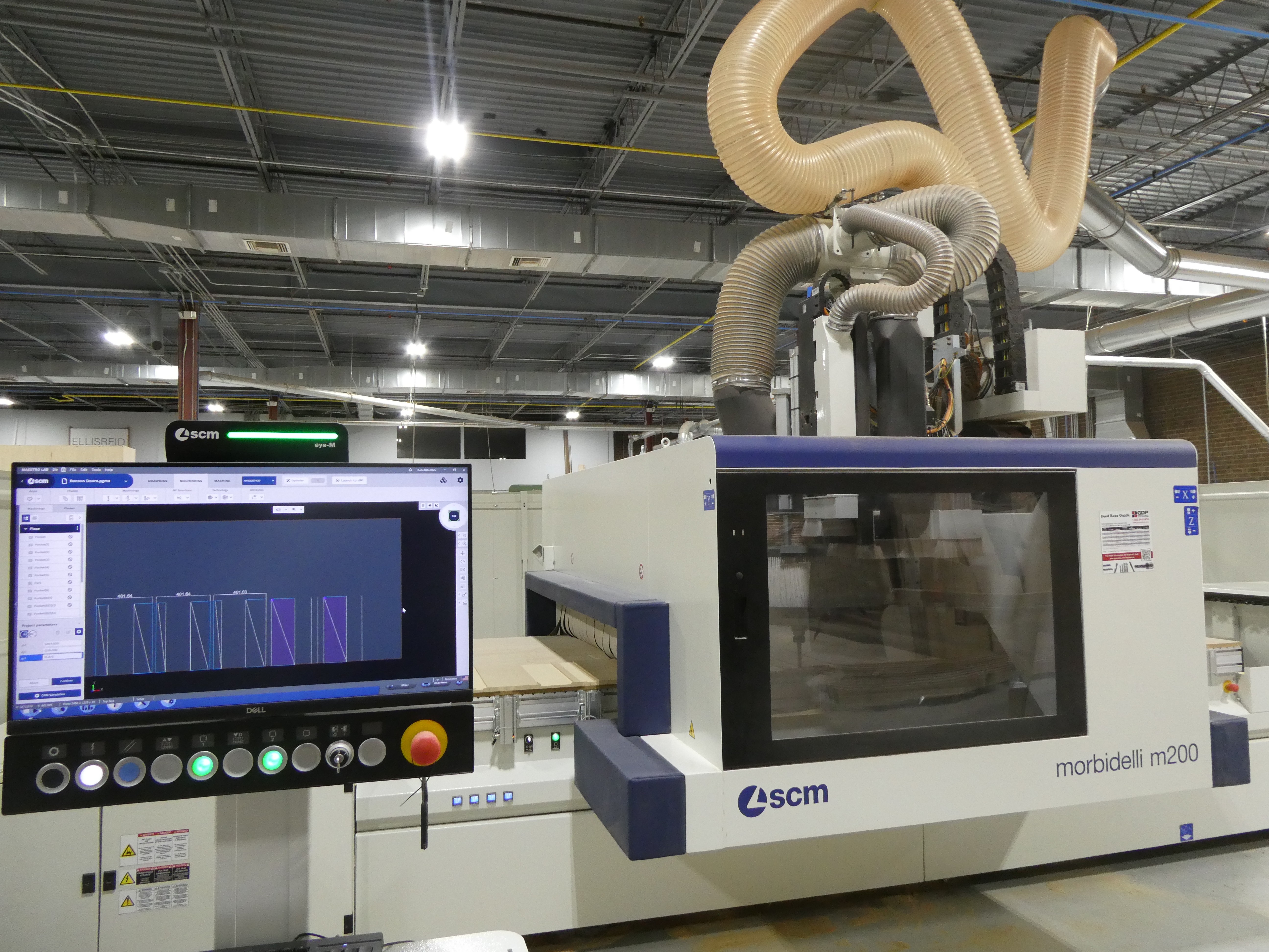 SCM Morbidelli m200 CNC router at Ellis-Reid's Monroe, NC shop, with the CAD nesting program displayed on the control screen