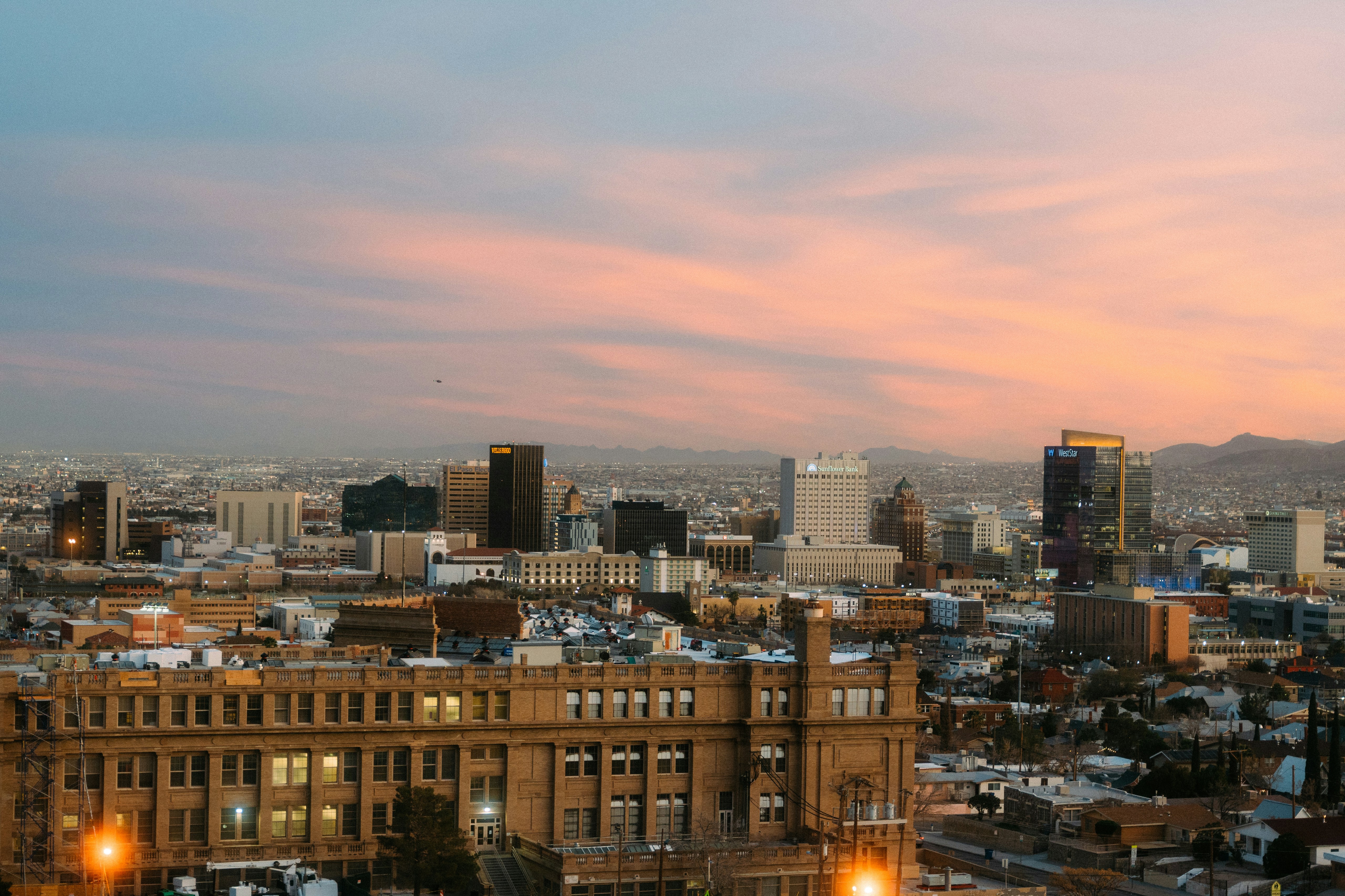 Downtown El Paso, Texas at dusk with the Franklin Mountains beyond