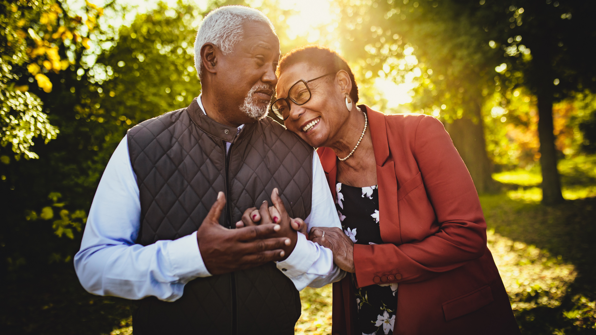 Close-up of elderly hands clasped together