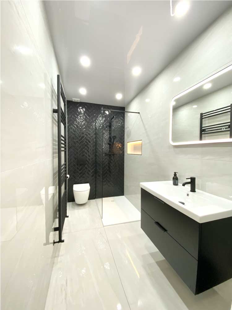 Completed bathroom renovation with herringbone tiling by Calico Joinery in Edinburgh