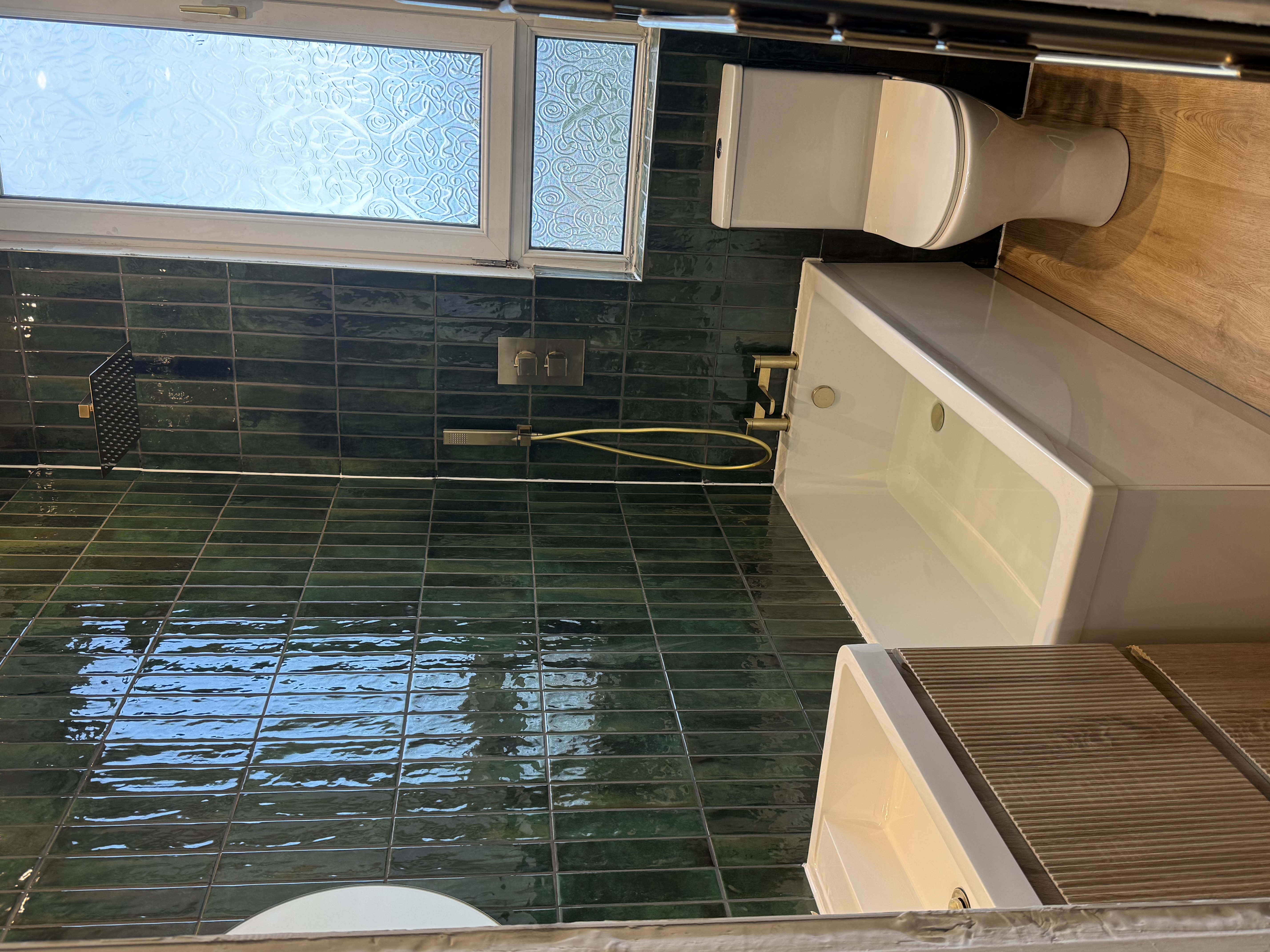 Green Tiled Bath completed bathroom renovation by Calico Joinery in Edinburgh