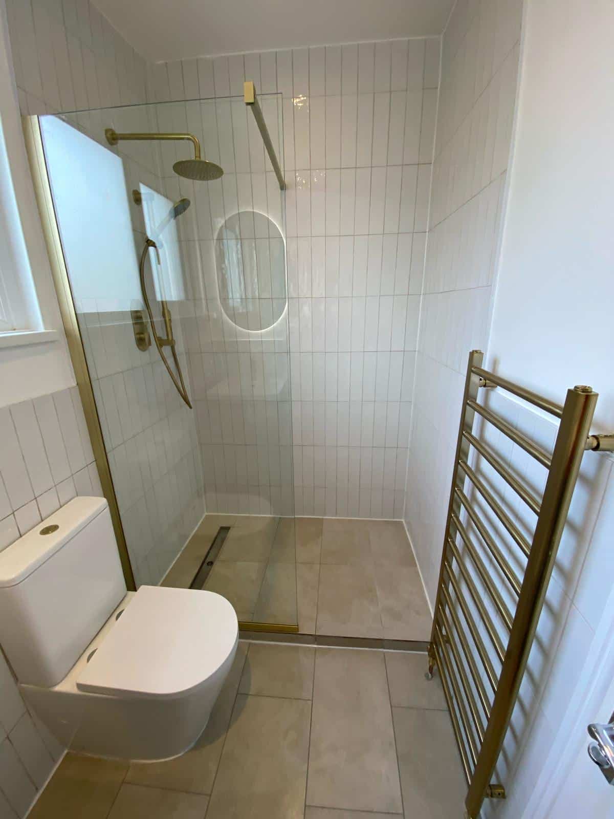 Gold Accent Shower completed bathroom renovation by Calico Joinery in Edinburgh