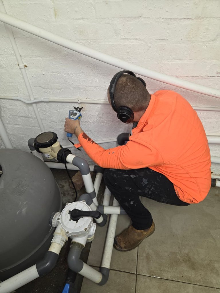 Technician using acoustic sensor