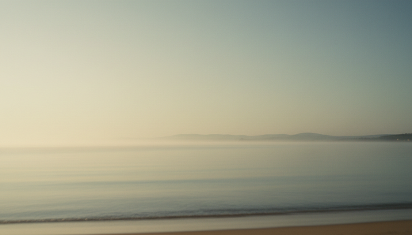 Serene misty coastline at golden hour