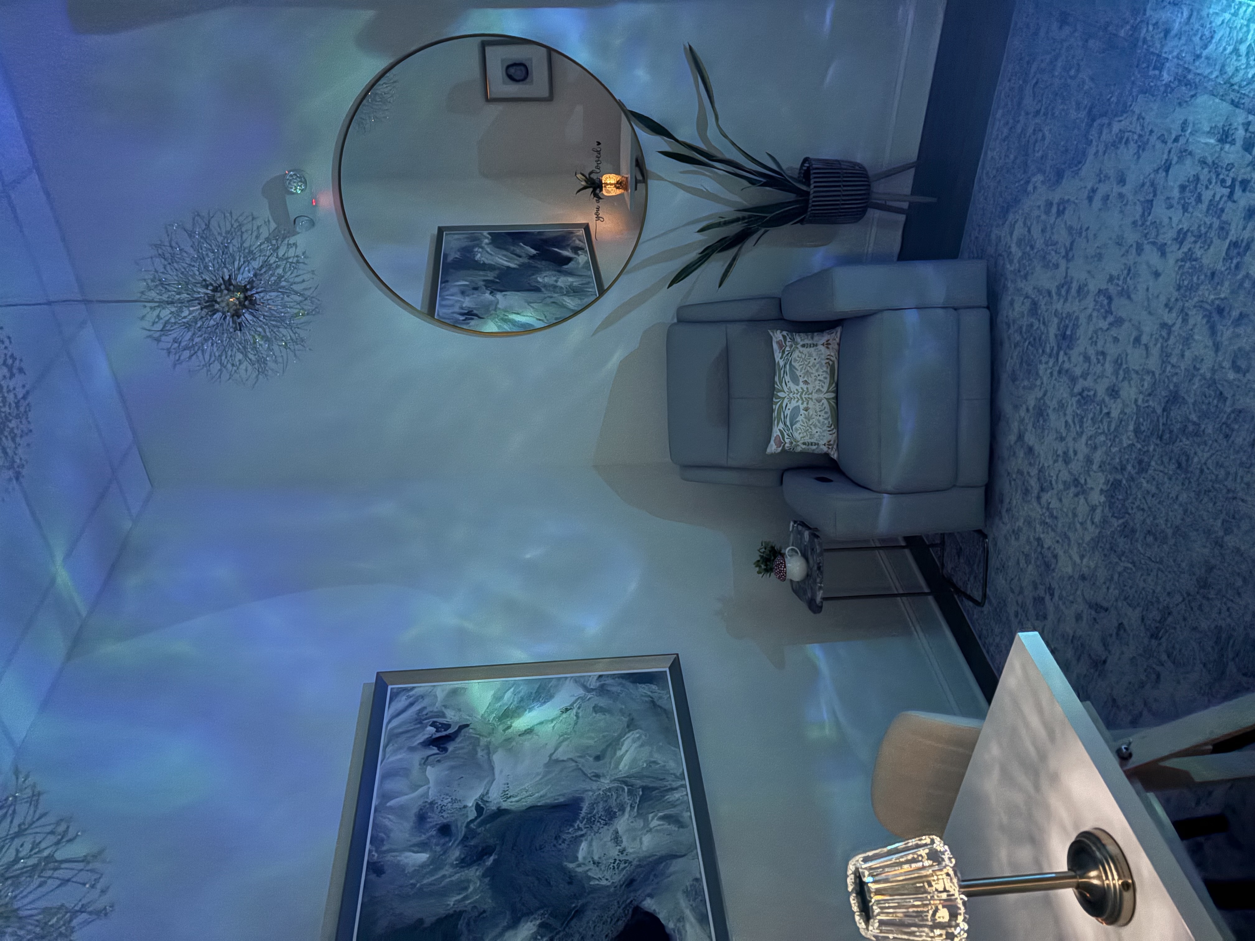 Calming blue-lit ketamine therapy room at Deep See Wellness