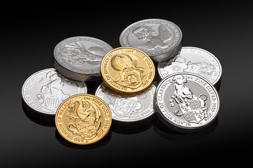 Gold Queen's Beasts fine gold coins on dark background