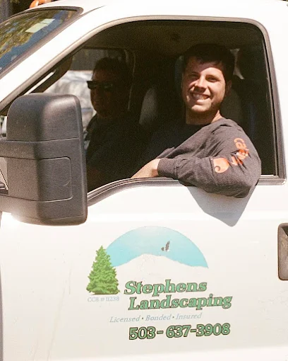 Owner of Stephens Landscaping operating a Kubota track loader on a job site