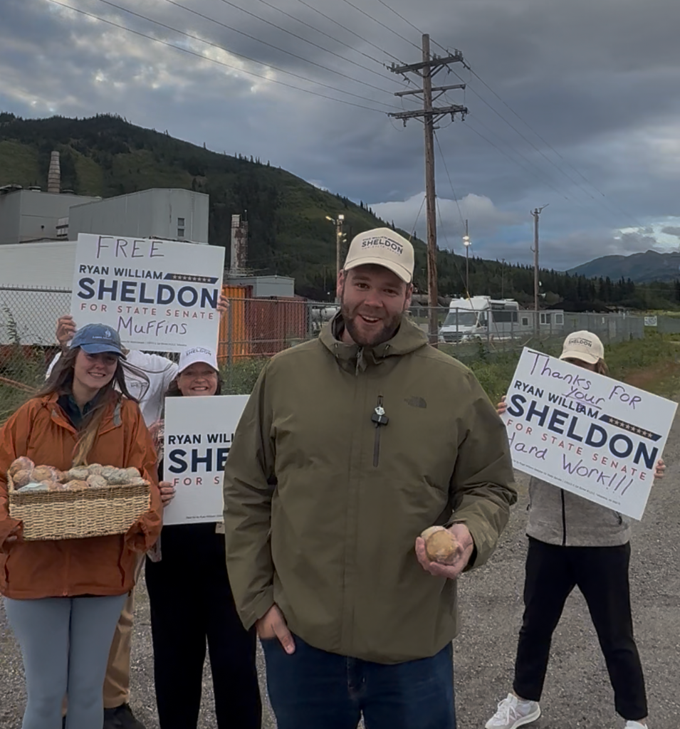 Ryan Sheldon with campaign supporters handing out muffins