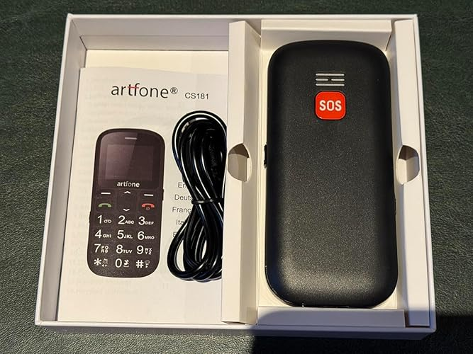 Artfone C1+ 4G box contents — phone, charger, manual, and SOS button