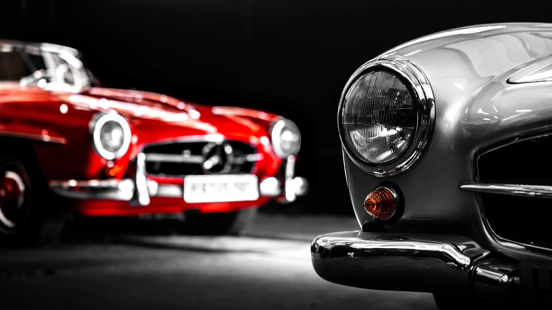 Detail of classic Mercedes-Benz cars in a darkened studio