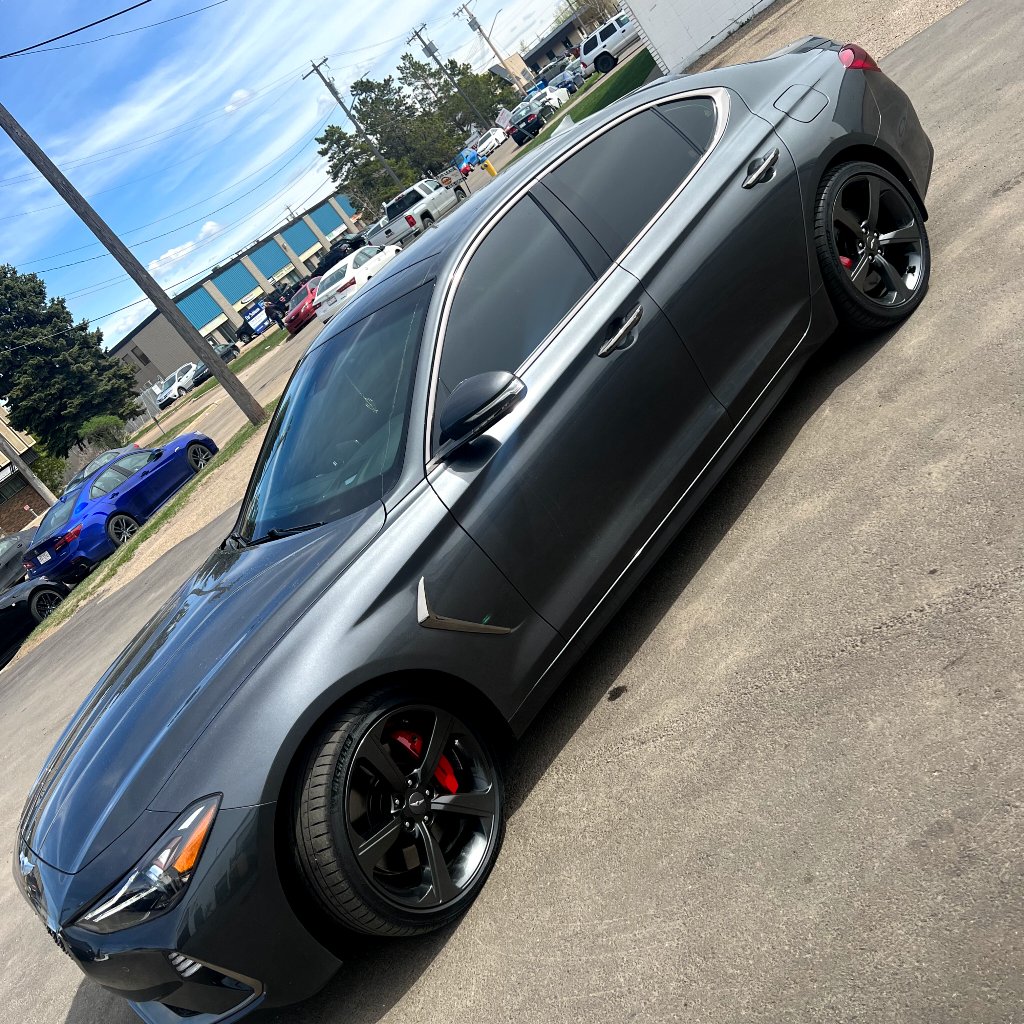 Genesis G90 rear glass with heat-rejection window film, finished at YEG Auto Studio