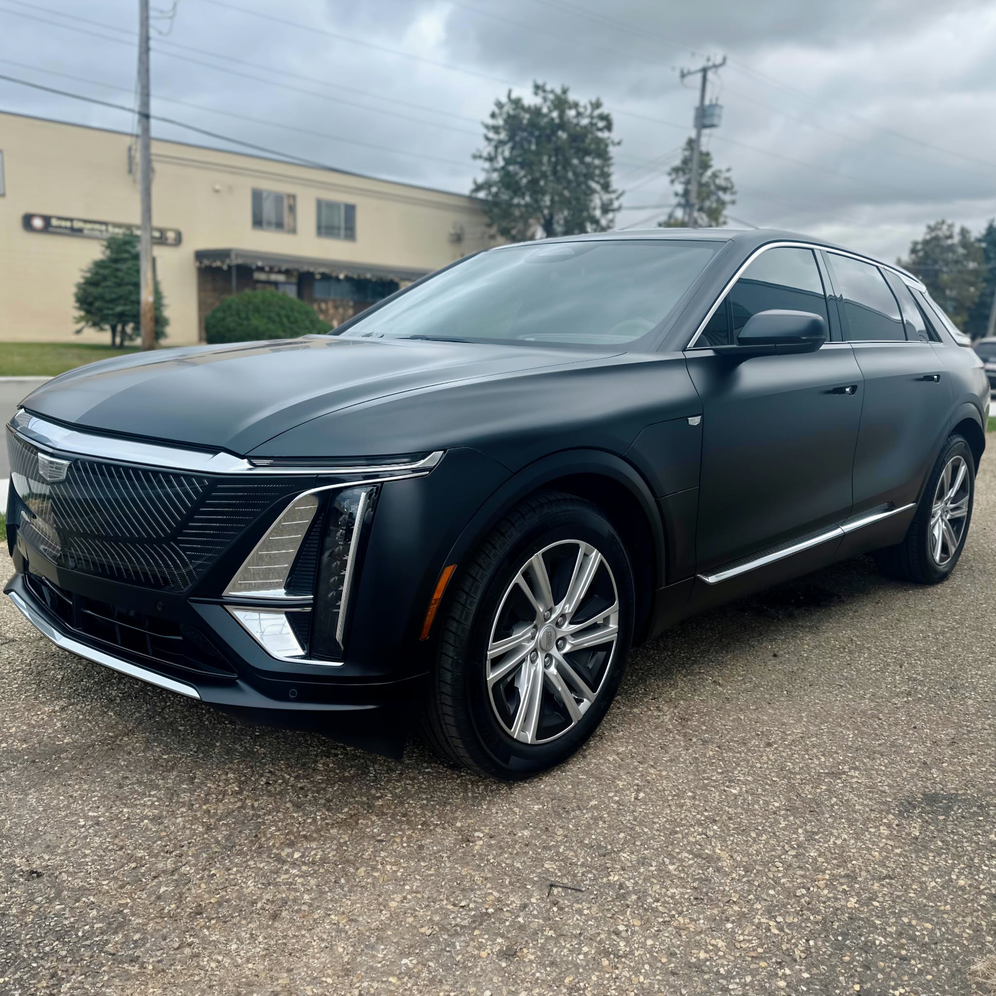 Black Cadillac SUV finished with a satin stealth paint protection film after installation in Edmonton