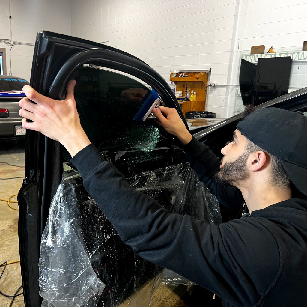 Genesis G90 side glass with premium window film installed in Edmonton