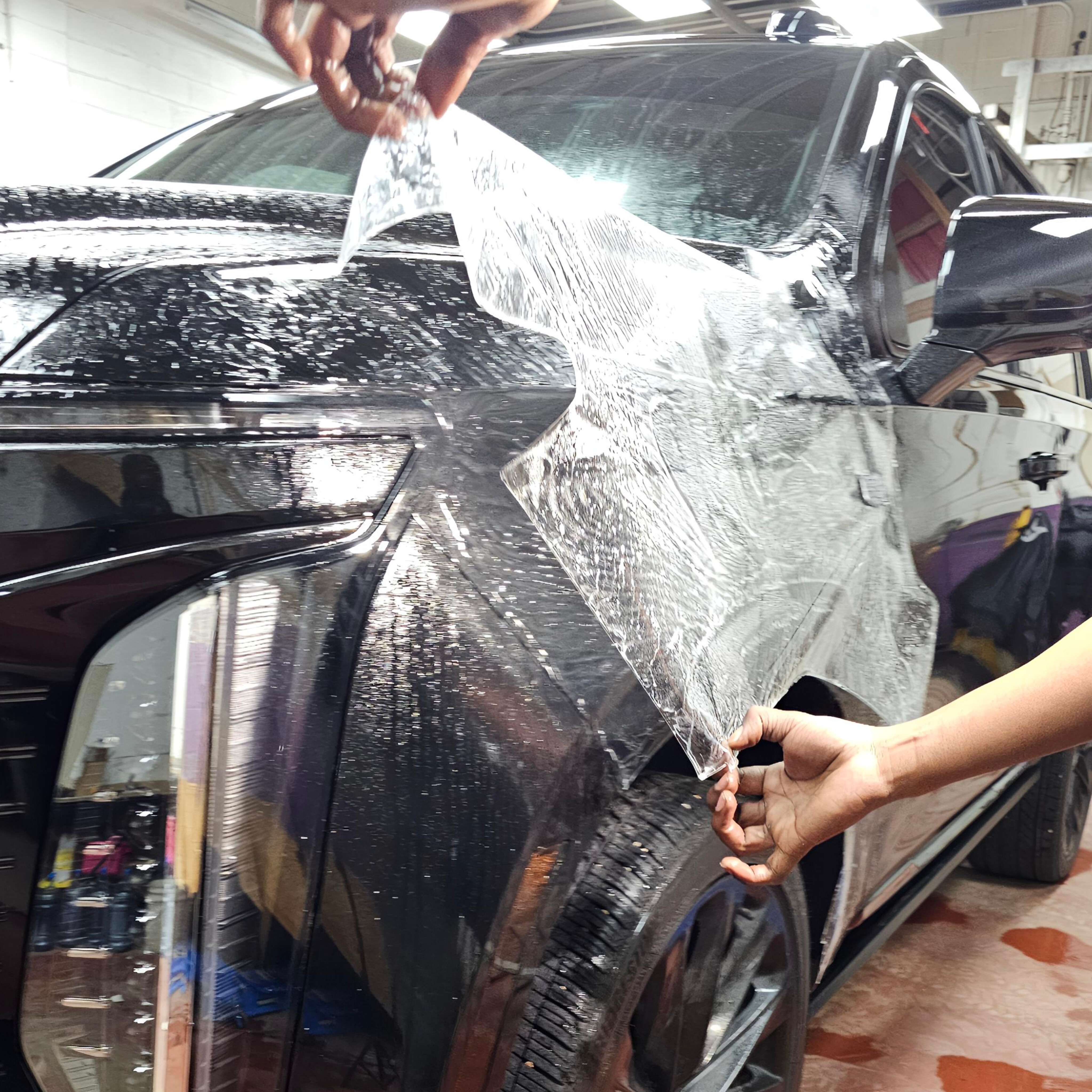 3M paint protection film installation on a black vehicle in Edmonton