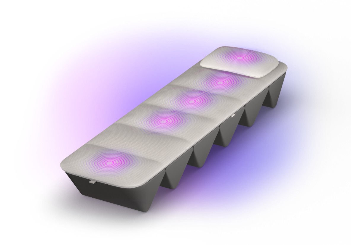 Opus Soundbed — sound and vibration therapy device with glowing hexagonal light patterns
