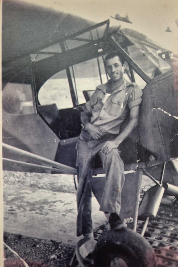 Carmel Shabi as a young soldier beside the aircraft he serviced, 1957