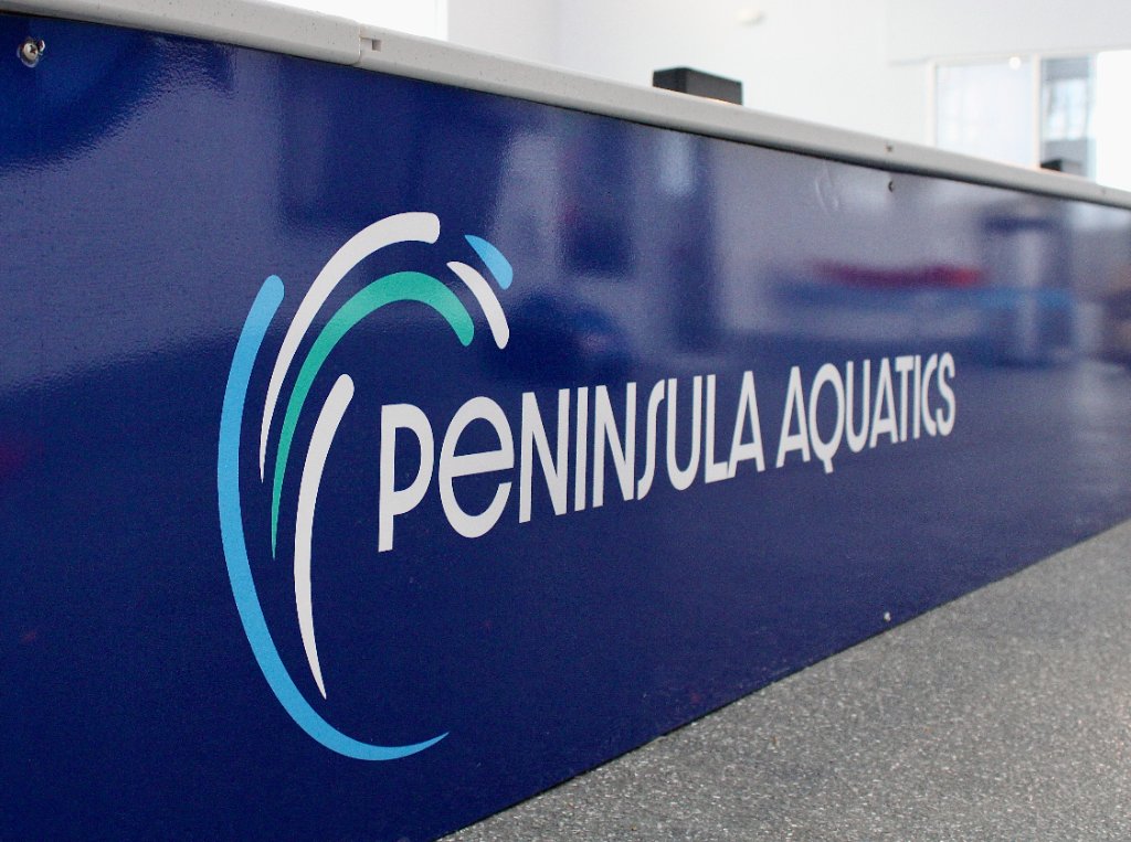 Peninsula Aquatics Center logo sign