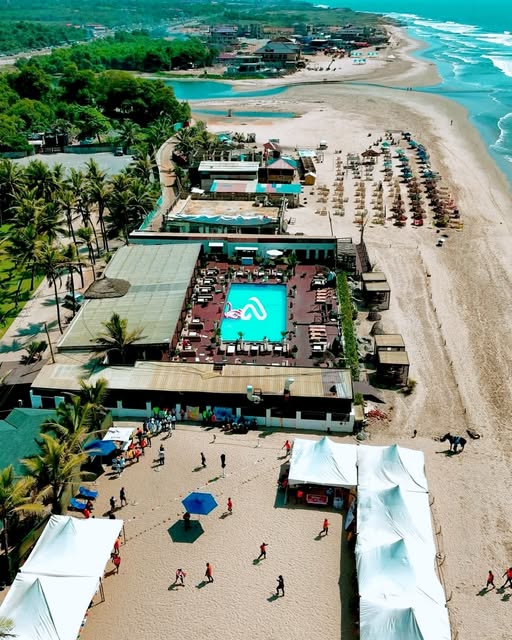 Aerial view of Labadi Beach resort in Accra with swimming pool, sandy beach and palm trees