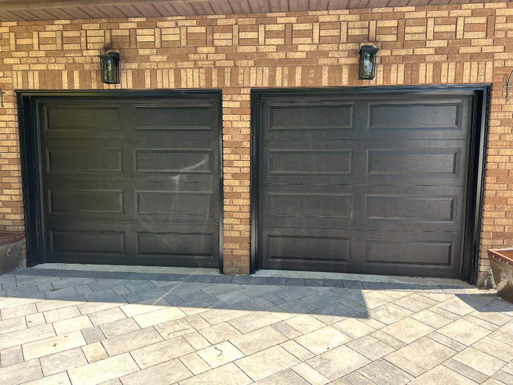 After — two new black garage doors installed