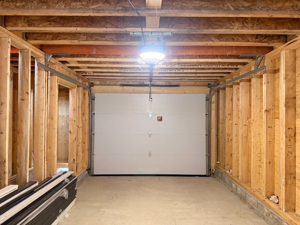 Interior view of garage door installation with framing in Dovercourt & Queen, Toronto