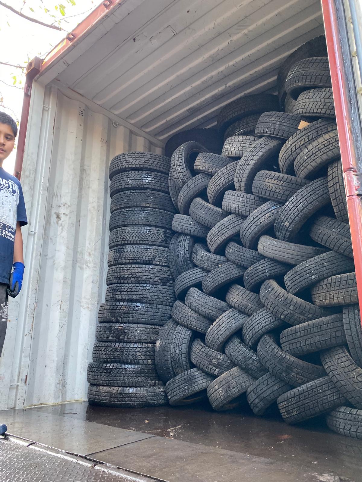 Isuzu truck cab in container — export shipment