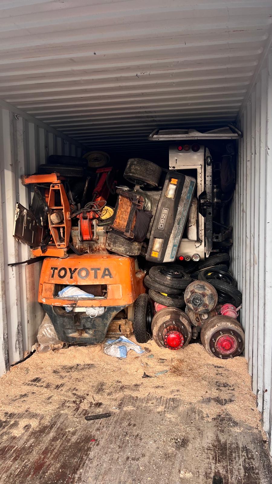 Engines on pallets — container loaded for export