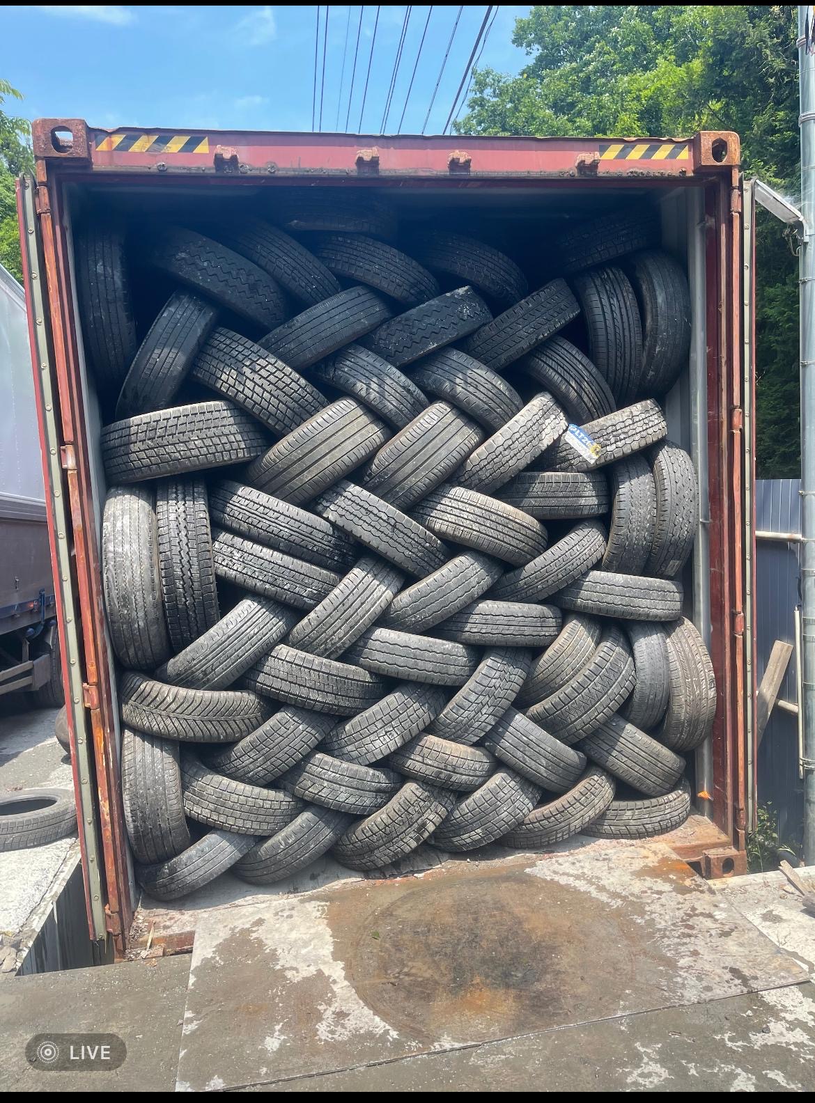 Tyres — container at dusk, Tochigi yard
