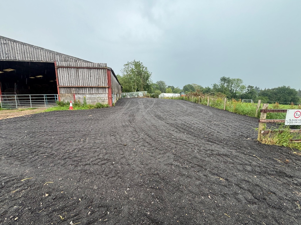Cleared and graded groundworks site surface prepared for construction by Subsoil Land & Water near agricultural barn in Cranbrook Kent