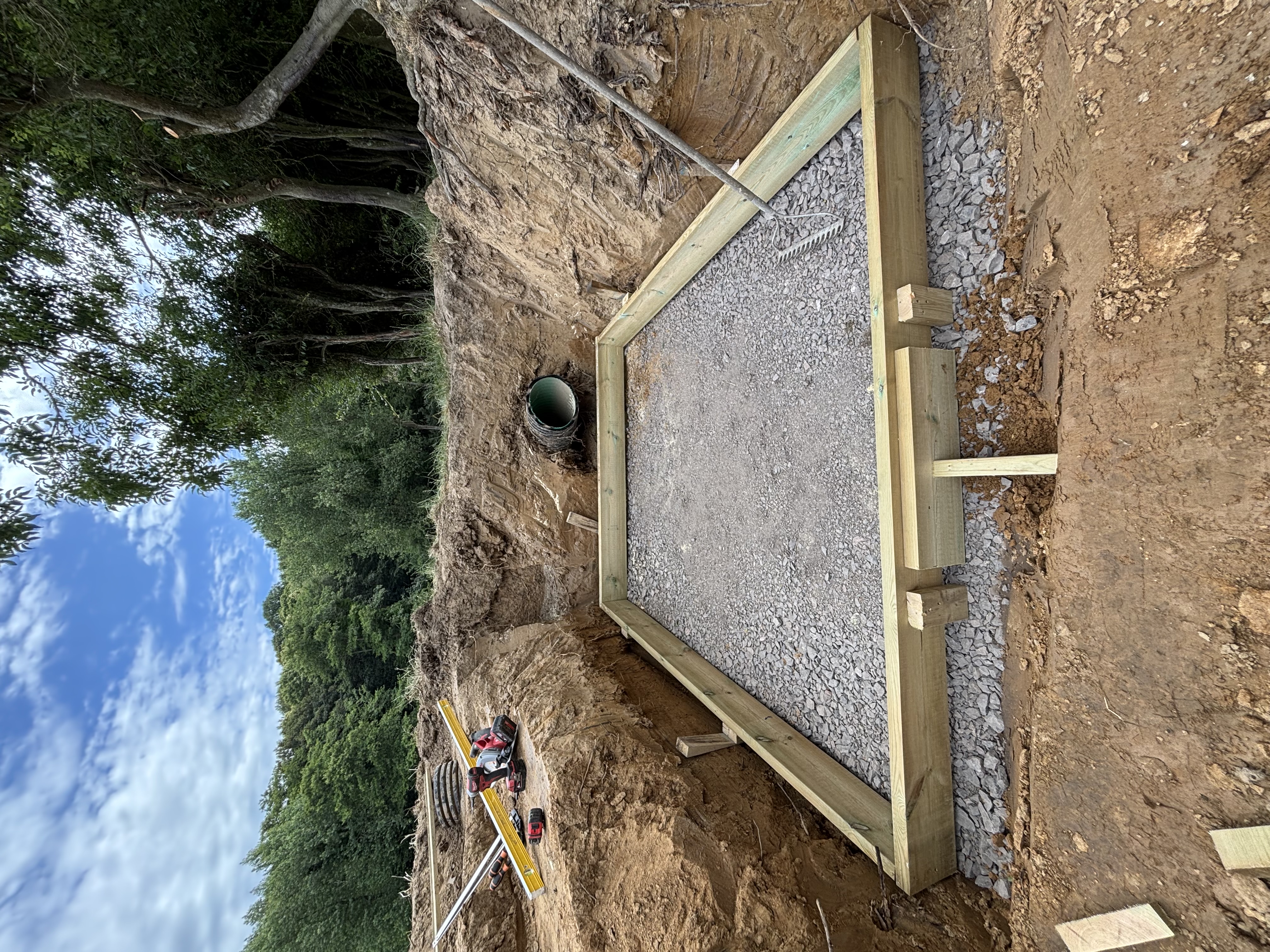 Site preparation with timber formwork and crushed stone sub-base ready for concreting and drainage installation in Sussex by Subsoil Land & Water, groundworks and concrete works contractors in Battle, East Sussex