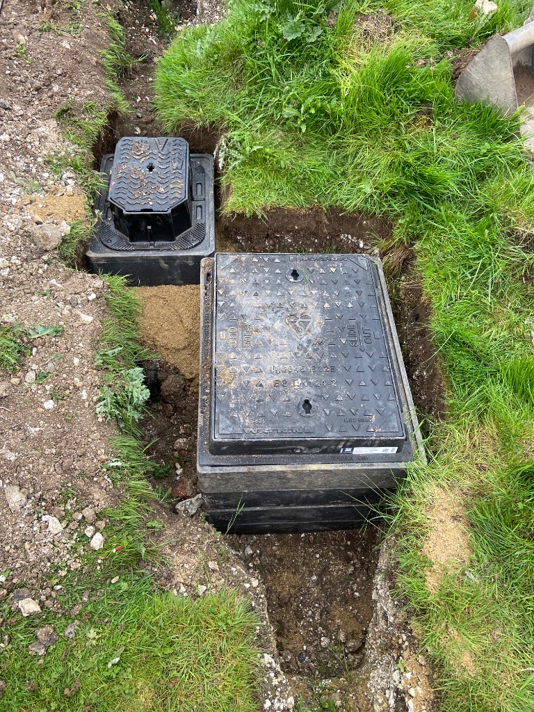 Wrekin BS EN 124-2 black utility inspection chambers installed in drainage trench by Subsoil Land & Water groundworks contractors in Tenterden Kent
