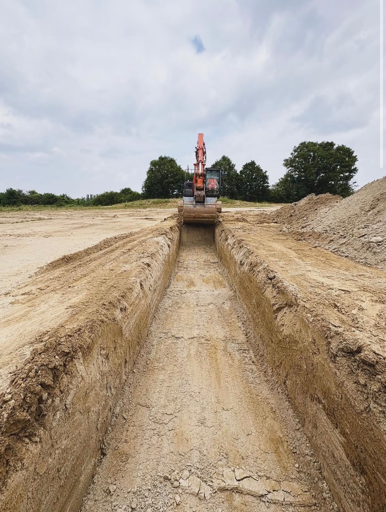 Long open trench excavated for water main installation and water pipe repairs in the South East by Subsoil Land & Water, trenching services and water utility contractors