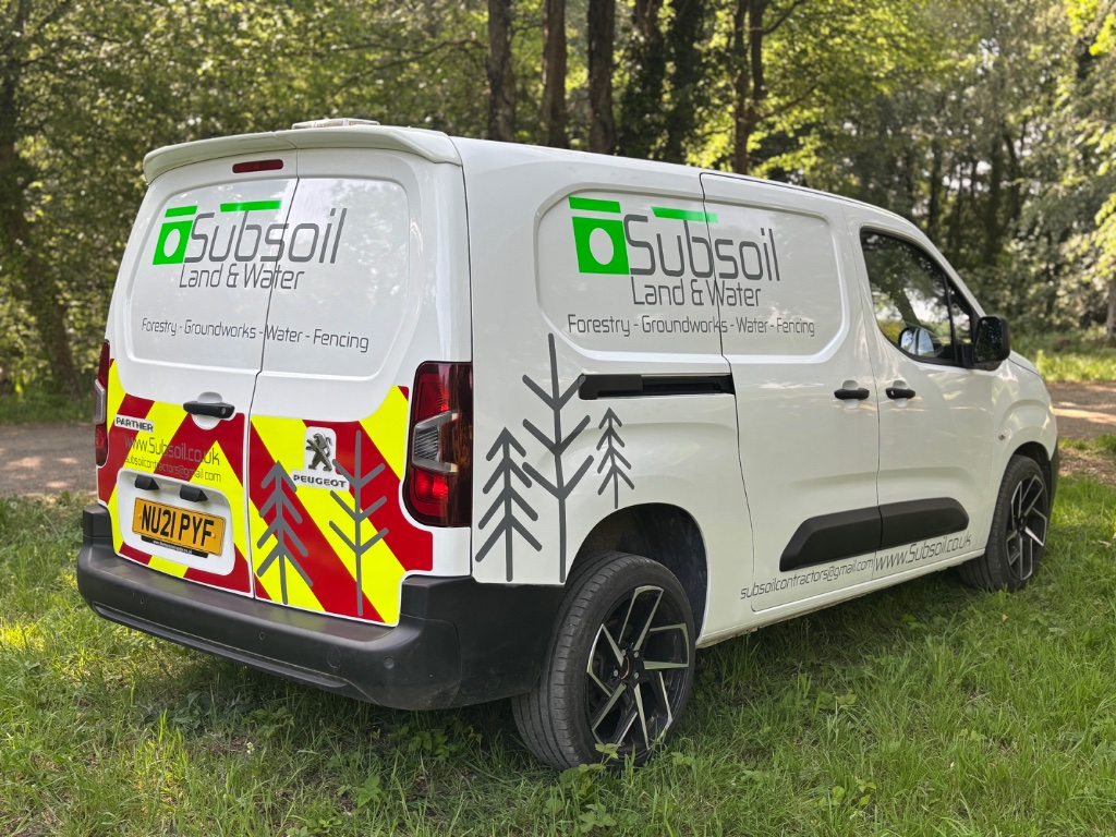 Subsoil Land & Water branded van parked at a rural groundworks site in East Sussex — independent local groundworks, drainage, and water utility contractors