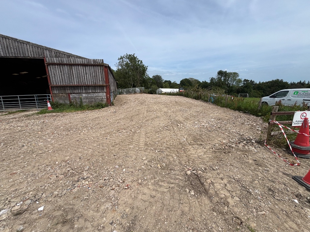 Subsoil Land & Water branded van on groundworks and site clearance project in Kent and East Sussex, showing cleared and graded earthworks site