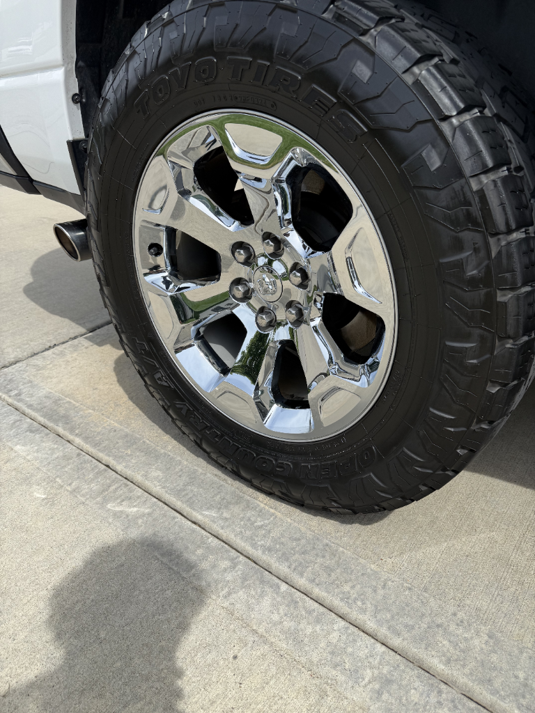 Chrome truck wheel and tire shining after detail