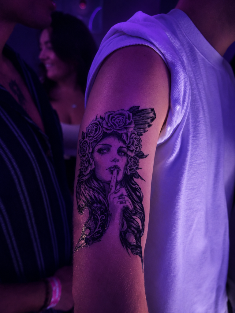Shushing woman tattoo