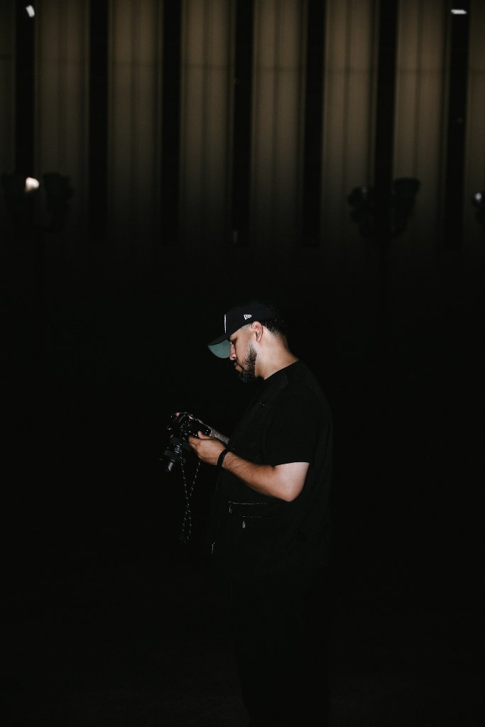Chris Diaz holding his camera