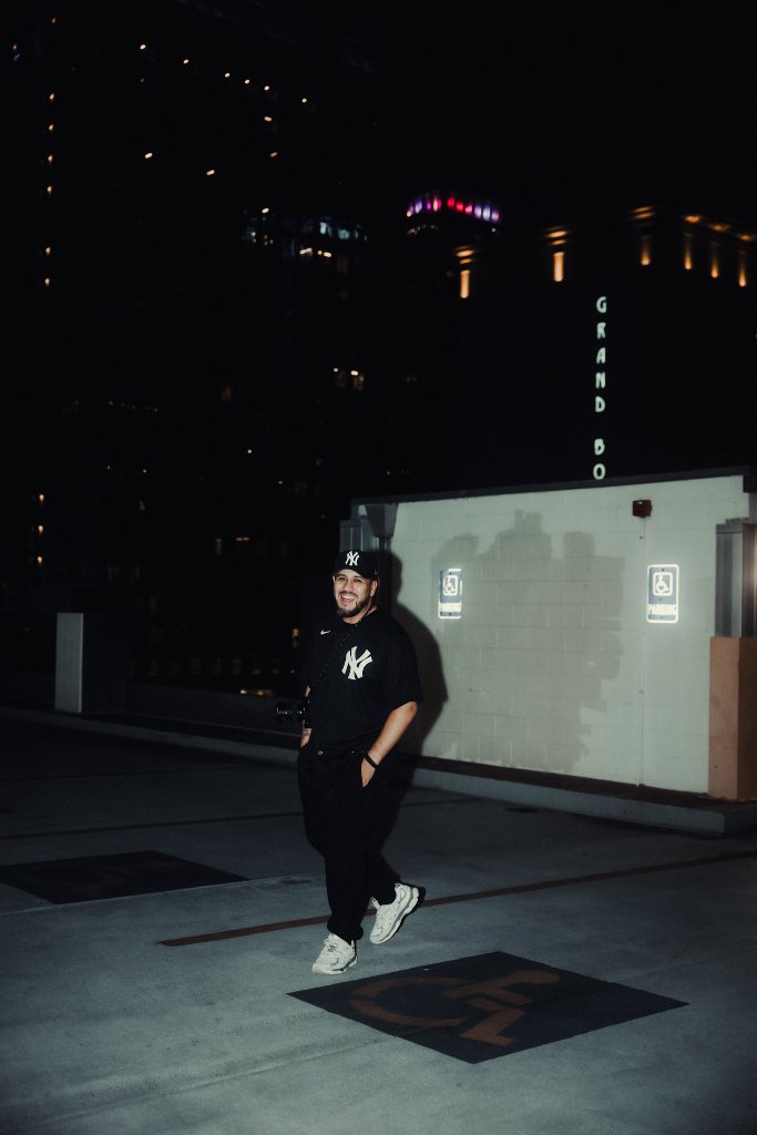 Chris walking a rooftop with his camera