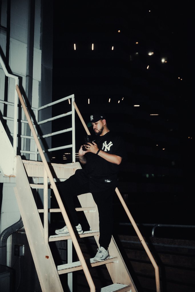 Chris reviewing footage on a stairwell at night