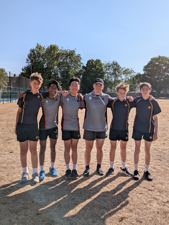 Sports club team standing together after a training session