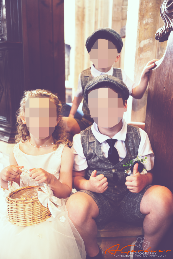 Children at a wedding, faces blurred for privacy