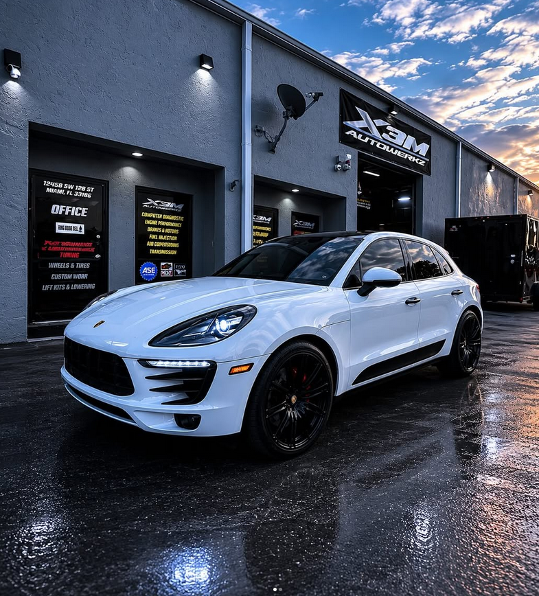 White Porsche Cayenne at dusk
