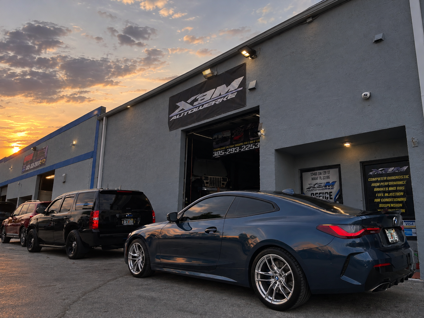 X3M Autowerke shop at sunset