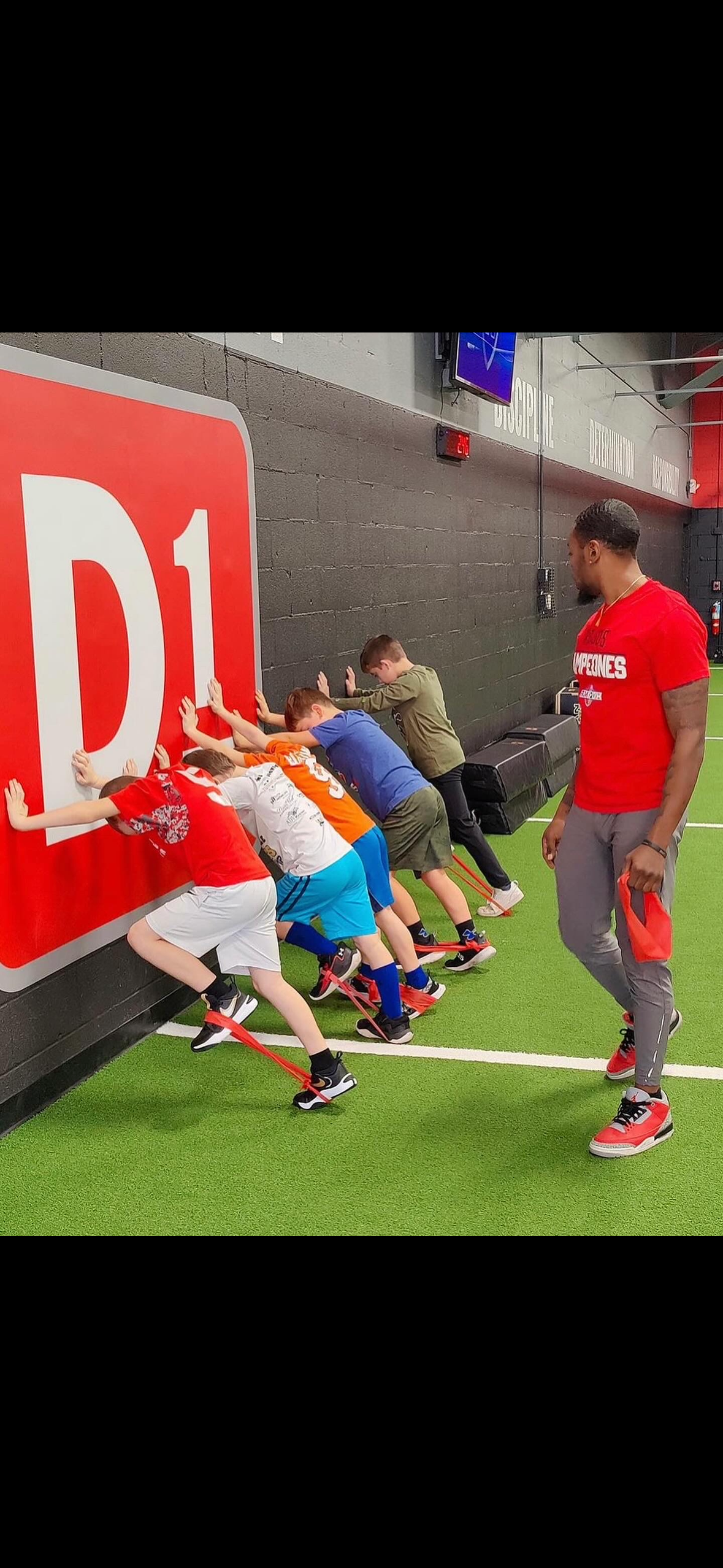 Coach JMar leading athletes through training