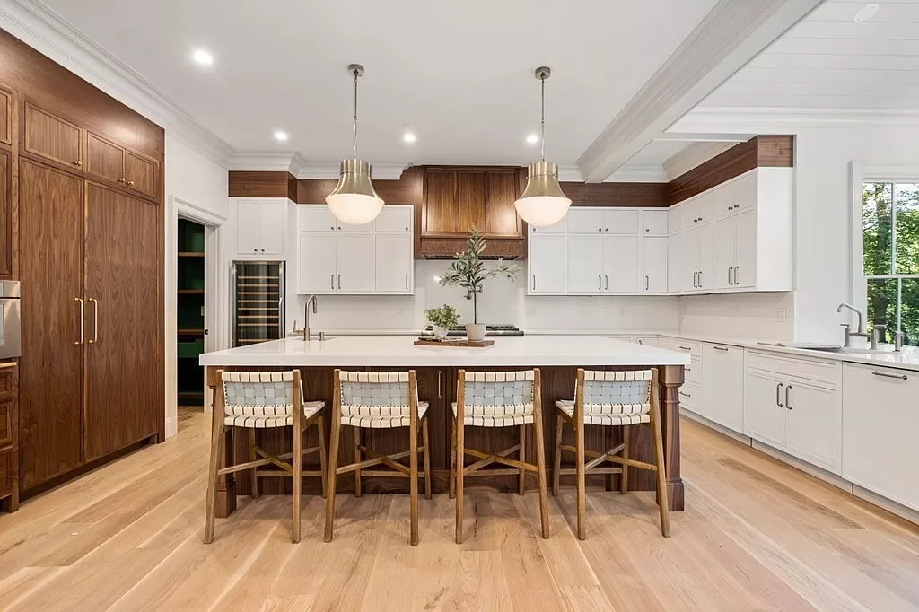 40 Old Farm — kitchen with white cabinetry, walnut island, and brass pendant lights